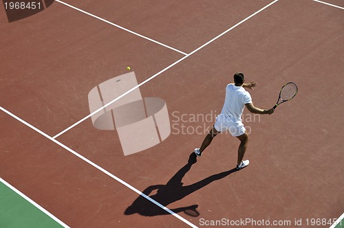 Image of young man play tennis