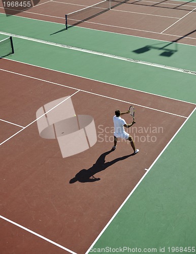 Image of young man play tennis