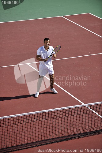 Image of young man play tennis