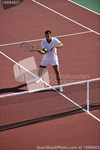 Image of young man play tennis
