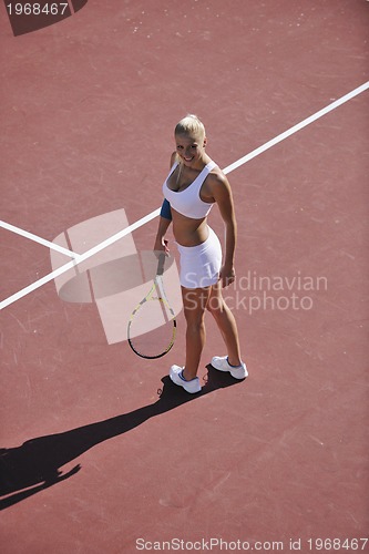 Image of young woman play tennis