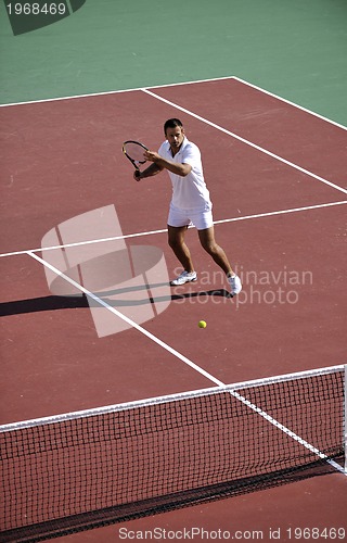 Image of young woman play tennis outdoor