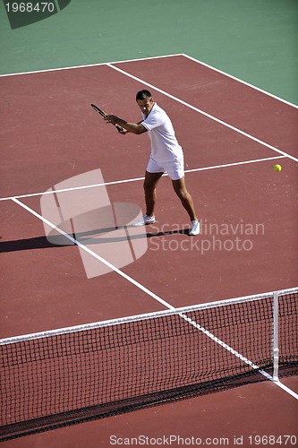 Image of young woman play tennis outdoor