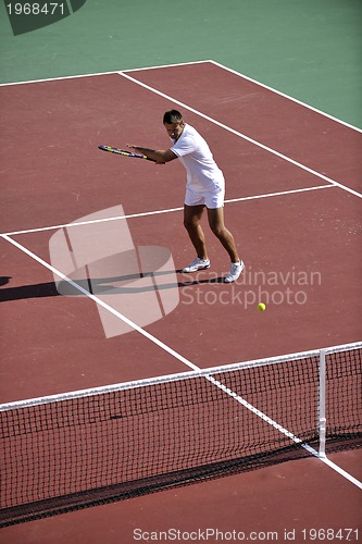 Image of young man play tennis