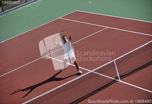 Image of young man play tennis