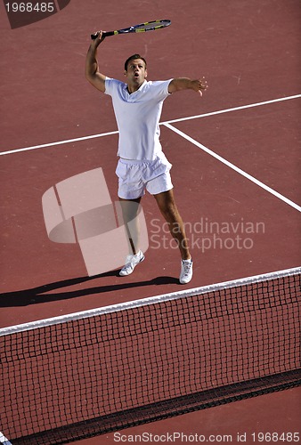Image of young man play tennis