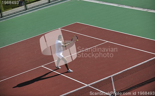 Image of young man play tennis