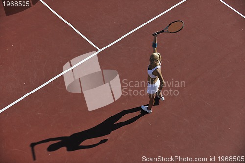 Image of young woman play tennis outdoor