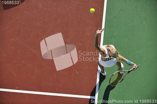 Image of young woman play tennis 