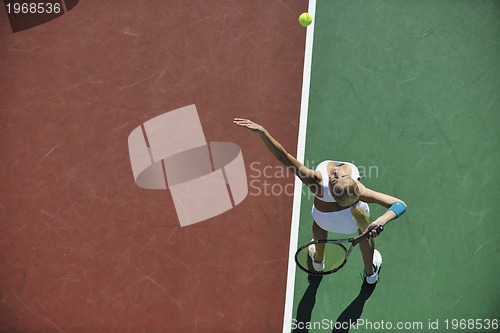 Image of young woman play tennis outdoor