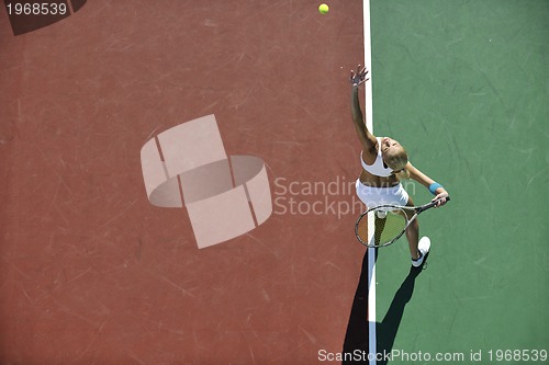 Image of young woman play tennis outdoor