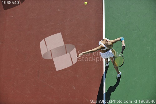 Image of young woman play tennis outdoor