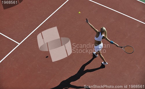 Image of young woman play tennis outdoor