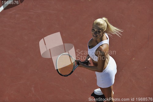 Image of young woman play tennis outdoor