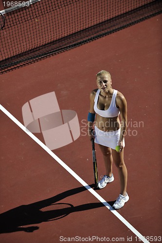 Image of young woman play tennis outdoor