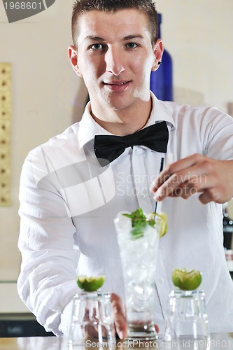 Image of pro barman prepare coctail drink on party