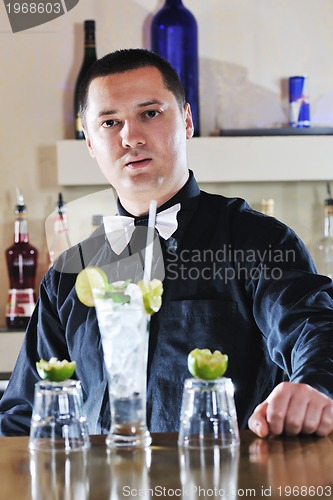 Image of pro barman prepare coctail drink on party