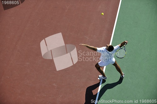 Image of young man play tennis