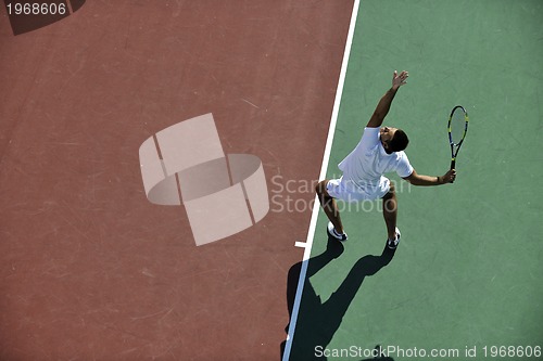 Image of young man play tennis