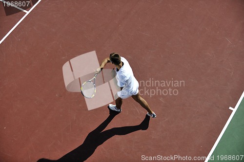 Image of young man play tennis