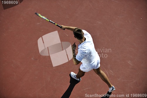 Image of young man play tennis