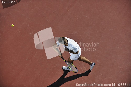 Image of young man play tennis