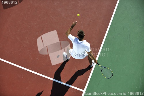 Image of young man play tennis