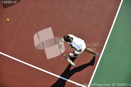 Image of young man play tennis