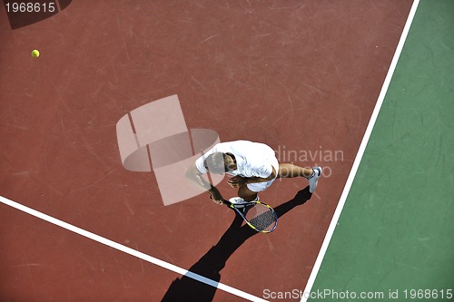 Image of young man play tennis