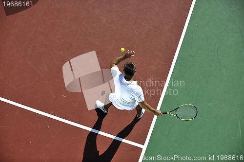 Image of young man play tennis