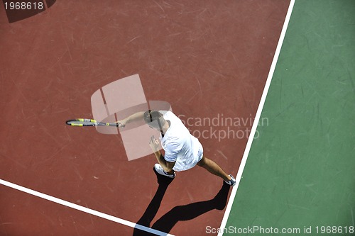 Image of young man play tennis