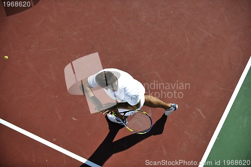Image of young man play tennis