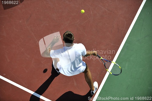 Image of young man play tennis