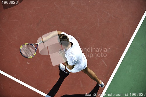 Image of young man play tennis