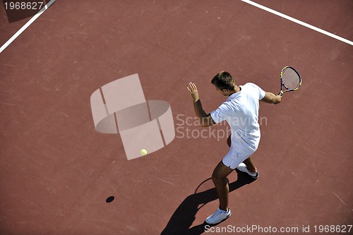 Image of young man play tennis