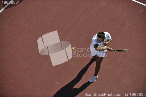 Image of young man play tennis