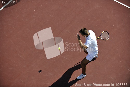 Image of young man play tennis