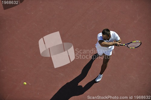 Image of young man play tennis