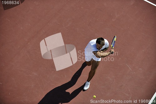 Image of young man play tennis