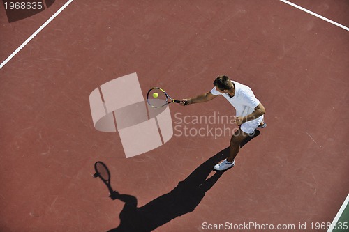 Image of young man play tennis