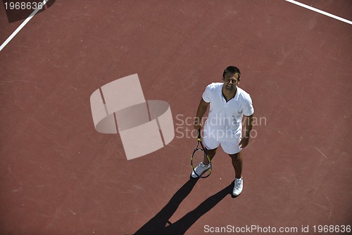 Image of young man play tennis