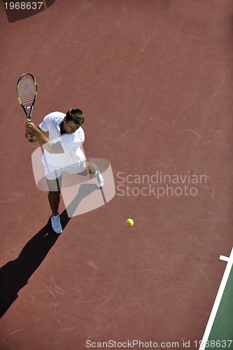 Image of young man play tennis