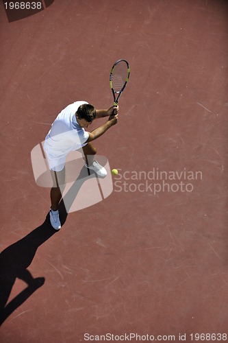 Image of young man play tennis