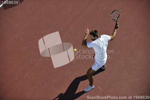 Image of young man play tennis