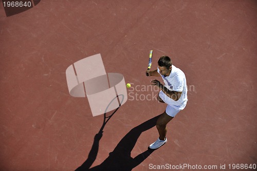 Image of young man play tennis