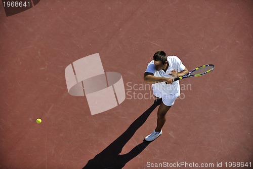 Image of young man play tennis