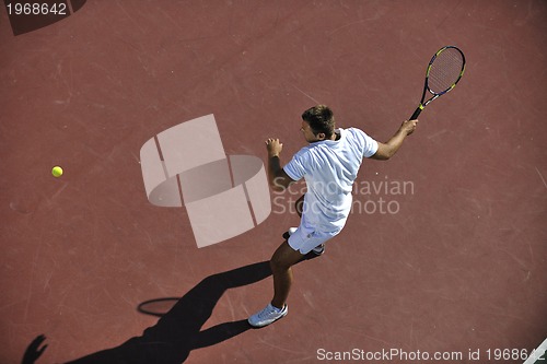 Image of young man play tennis