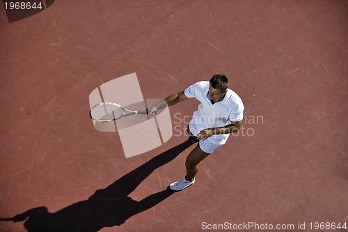 Image of young man play tennis
