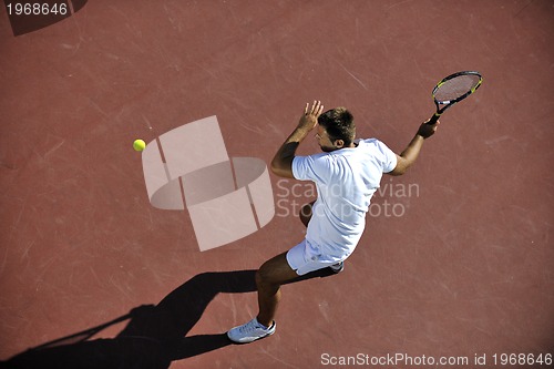 Image of young man play tennis