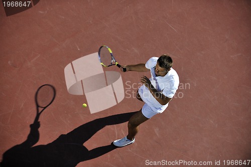 Image of young man play tennis